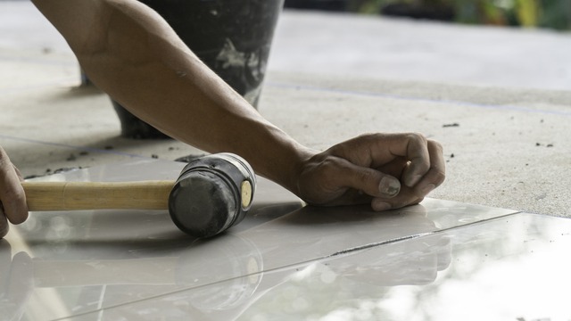 Master Installer Laying Tile, Tile Work And Construction.