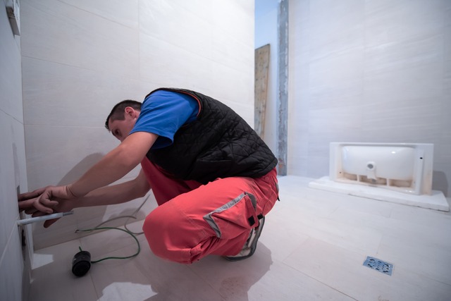 Professional Plumber Working In A Bathroom
